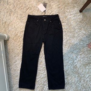 Black straight / wide leg black jeans. Slight crop